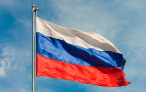 russian flag on a pole over beautiful sky