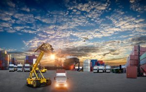 Industrial Container Cargo freight ship, forklift handling container box loading for logistic import export and transport industry concept