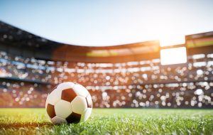 Football soccer ball on grass field on stadium. Sport