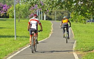 couple of cyclists riding on bike path in ecological park, Indaiatuba, São Paulo, Brazil. February 13, 2022.