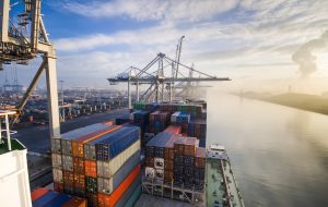 Sunrise in busy container terminal in Rotterdam, Netherlands.