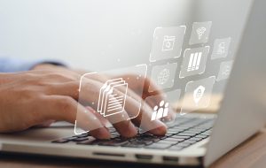 a business man using a computer to manage documents online document communication database and digital file storage systems/software record keeping database technology file