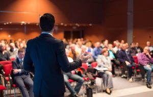 Speaker at Business Conference and Presentation. Audience at the conference hall.
