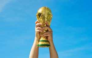 "Los Angeles, California, USA - May 12th 2010: Hands holding up a replica of the Soccer World Cup previous to South Africa's Tournament."
