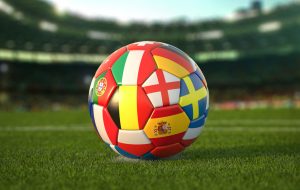 Soccer Football ball with flags of european countries on the grass of football stadium. Euro championship 2021. 3d illustration