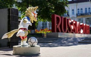 ROSTOV-ON-DON, RUSSIA - 11 June, 2018 The official mascot of the 2018 FIFA World Cup and the FIFA Confederations Cup 2017 wolf Zabivaka  scores a goal. A monument with the letters "Russia 2018"